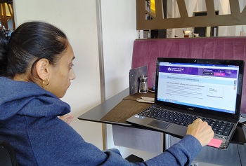 Ramandeep loking at Hounslow's website on support
