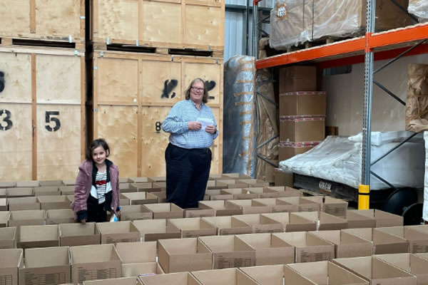 Packing Easter hampers at a Heathrow warehouse 
