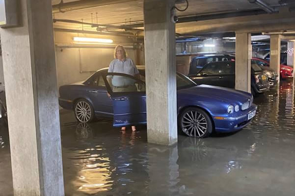 Guy's car flooded in basement
