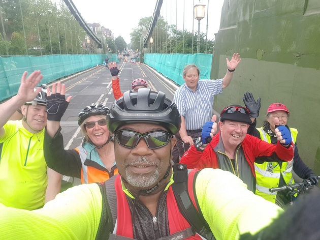 Cycling across Hammersmith Bridge