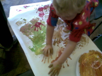 Boy painting hands