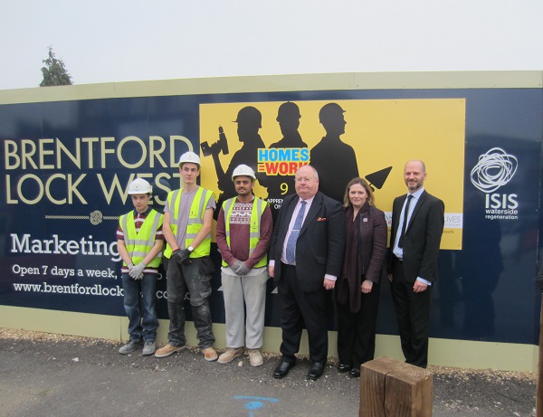 Mary with the Communities Secretary, Eric Pickles, and apprentices from housebuilders Wilmott-Dixon