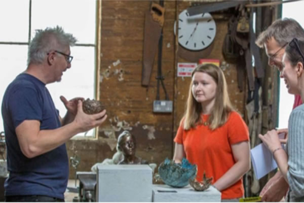 Visitors can hear artists explain their work on the Creative Mile 