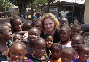 Mary Macleod visits children in a village in Liberia